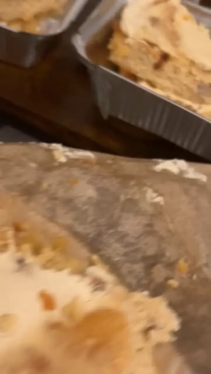 Almond flour lemon cake cooling in foil trays.
